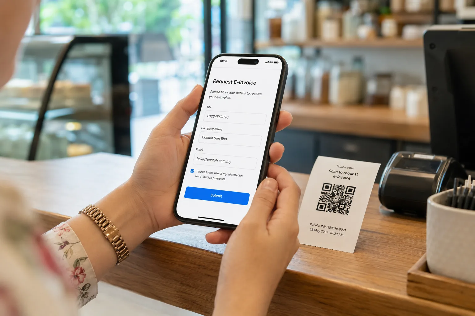Customer scanning a receipt QR to request an e-invoice on their phone